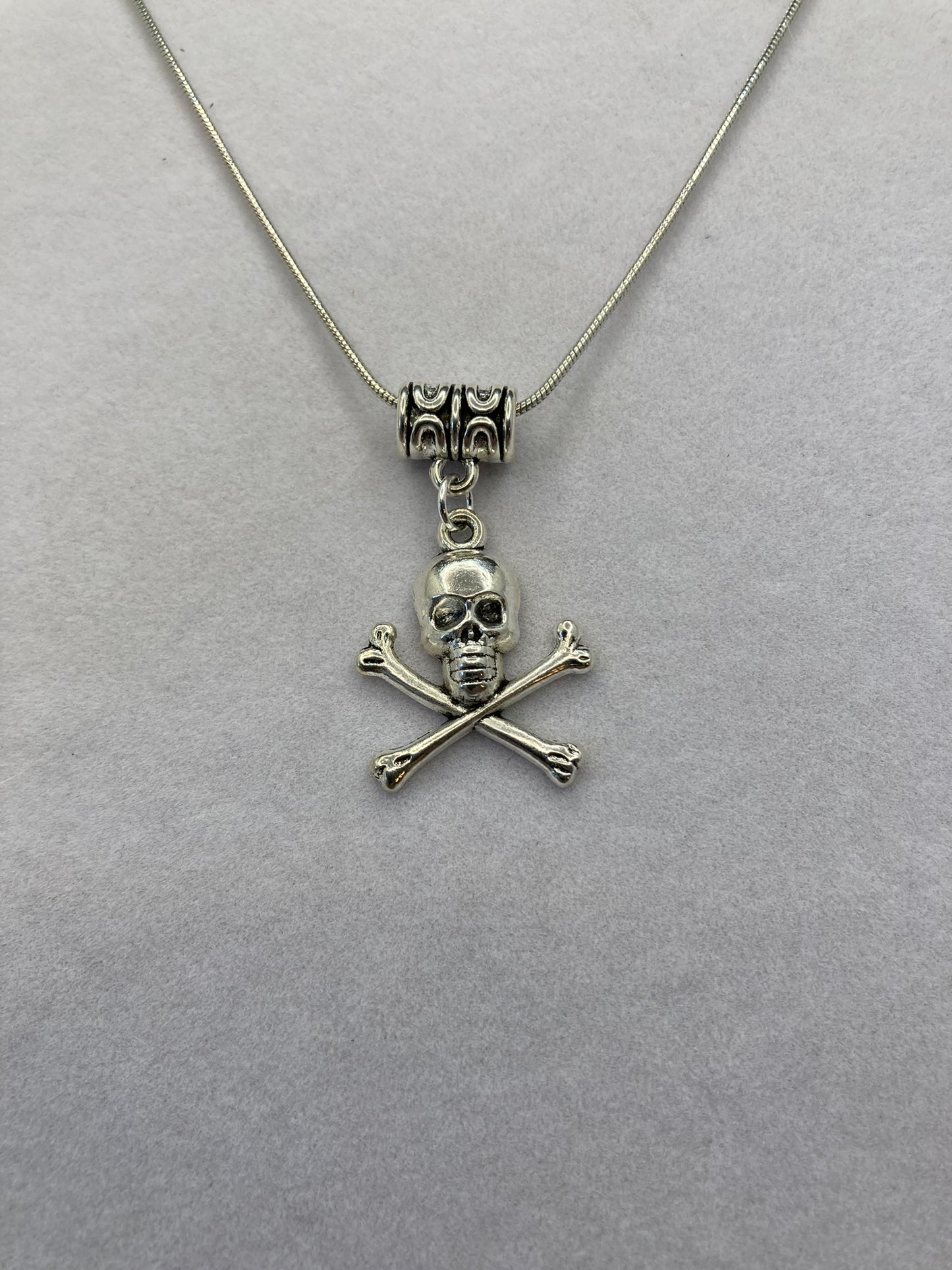 Skull and Crossbones Silver Tome Necklace and Pierced Earring Set